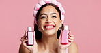 Skincare, products and face of woman in studio with natural, beauty and facial glow for cosmetics. Happy, confident and portrait of female person with dermatology treatment by pink background.