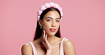 Skincare, face or woman with headband in studio, natural glow or beauty routine for soft texture. Dermatology, portrait of person and hair band for self care, facial shine or space on pink background