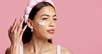Apply, skincare and woman in studio with cream, natural cosmetic and wellness for healthy skin. Thinking, confident and female person with moisturizer, beauty and mockup space on pink background.