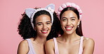 Beauty, face and women in studio with headband, friends or bonding in skincare routine. Facial, cosmetic or female people with hair accessory on pink background, spa day or quality time in self care.