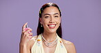Face, perfume and happy woman in studio with spray, hygiene product and scent for body odor. Smile, luxury fragrance and female person with aroma, smell and natural cosmetic on purple background.