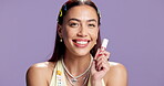 Woman, lip gloss or face in studio with smile, make up or radiant in mockup space. Happy, confident person or model for beauty with purple background, cosmetic or brand advertisement for trends