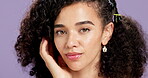 Woman, skincare face and studio with beauty, touch and thinking of curly hair on purple background. Healthy skin, dermatology and natural glow for wellness, self care and portrait for girl with afro