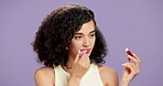 Lip gloss, woman or face in studio with application, makeup or cosmetic for brand advertisement. Smile, person or mockup space on purple background with product, application or trends for beauty
