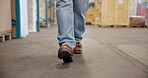 Logistics, walking or legs of man in warehouse for inspection, storage or distribution of stock. Supply chain, quality control or employee in factory for cargo export, order or inventory to transport