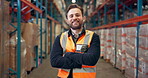 Construction, face portrait and worker in warehouse with arms crossed, smile and leadership for logistics. Man, engineer and professional in industry with confidence, happy or success for management