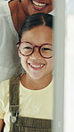 Glasses, optometrist and girl with mirror, talking and wellness with frames, excited and prescription. Happy child, optician and kid with eyewear, clear vision and reflection with spectacles or smile