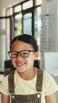 Girl, face and optometrist with glasses, smile and pov in mirror with eye test, choice and excited at shop. Person, child and happy with decision for spectacles, customer experience and prescription
