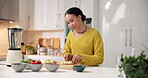 Blender, woman cutting fruits in house for smoothie, detox or benefits in morning shake. Organic, drink prep or nutritionist in kitchen with mixer, heart health or muscle support in breakfast juice.