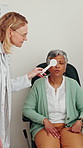 Eye care, reading test and woman with occluder, doctor and health insurance with help. Advice, eyesight consultation and mature patient in exam to check eyes for glasses, lens and assessment