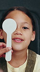Optometry, eye exam and face of girl in clinic with cover for consulting, prescription lens or vision test. Healthcare, optician tools and portrait of kid with diagnosis for glasses, frames or sight