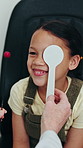 Optometry, eye exam and child in clinic with cover for consulting, prescription lens and vision test. Healthcare, optician tools and girl with optometrist with diagnosis for glasses, frames and sight