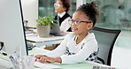 Computer, business and kid typing in office for accounting report, budget or email for role play. Happy girl, reading and writing with desktop in workplace for bookkeeping, finance info and pretend