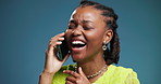 Black woman, phone call and laugh with talk in studio for gossip, chat and mockup space on blue background. African girl, smartphone and happy for conversation, contact and listen to funny story