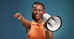 Black woman, megaphone and pointing to you for winning, prize or sale on blue background. African person, smile and voice with bullhorn, loudspeaker and choice for selection with excited announcement