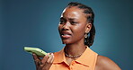 Doubt, phone and voice note with black woman in studio for communication, feedback or update. App, confused and contact with African person on blue background for conversation or phishing scam