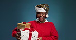 Happy, christmas and face of black woman with present for tradition, festive or holiday surprise. Excited, smile and portrait of African person with xmas gift for celebration by studio background.
