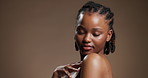 Skincare, face and shoulder with black woman in studio for beauty, body care and glow. Dermatology, mockup space and shine with person on brown background for aesthetic, clear skin and collagen