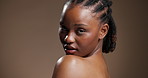Beauty, face and shoulder with black woman in studio for skincare, body care and glow. Dermatology, mockup space and shine with person on brown background for aesthetic, clear skin and collagen