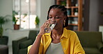 Drinking, health and black woman in house with water, hydration or digestion support. Wellness, h20 and female person in living room with cold beverage, mineral liquid and detox for thirst and relax.