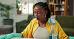 Yawn, black woman and tired form cleaning at house with detergent, bacteria removal and burnout. Fatigue, person and exhausted from housekeeping, household chores and hygiene maintenance for wellness