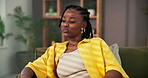 Thinking, sad and loss with black woman on sofa for reflection, breakup trauma and grief. Mental health, depression and perspective with person in living room of home for heartbreak memory and lonely