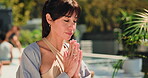 Meditation, mature and prayer hands with woman in class for spiritual retreat, namaste and balance. Zen exercise, holistic healing and yoga with people for mindfulness, peace and self care mindset