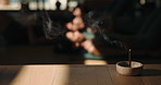 Incense, smoke and meditation in yoga class for peace, mindfulness or holistic wellness. Aroma stick, zen and people with atmosphere for relax, healing or aromatherapy with yogi group on studio floor