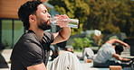 Drinking, water and man on break, athlete and prevention of dehydration with beverage and nutrition. Thirsty, person and wellness with liquid for hydration, fitness and body regulation with minerals