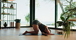 Yoga, woman and stretching with zen in home for mobility, flexibility and core muscle strength. Pilates, balance and warm up for arms, legs and posture exercise on floor with mindfulness or wellness