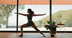 Yoga, woman and stretching with zen in house for mobility, flexibility and core muscle strength. Pilates, balance and warm up for arms, legs and warrior pose for posture with mindfulness or wellness