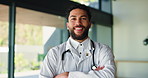 Face, man and doctor with arms crossed in hospital for career pride, about us and medical services. Portrait, surgeon and confident with ambition, patient care and positive attitude for healthcare