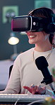 Metaverse, typing and vr headset with woman in studio for content creation or product review. Computer, microphone and virtual reality with happy influencer person live streaming for subscription