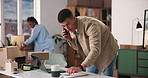 Man, phone call or laptop with boxes for logistics, delivery or shipping in small business startup. Male person, distributor or supplier talking with mobile smartphone or computer for courier service