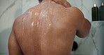 Back, skincare and shower with man in bathroom for body care, morning routine and water splash. Beauty hygiene, glow and dermatology with person washing in home for cleaning, grooming and hydration