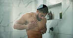 Body, skincare and shower with man in bathroom for self care, morning routine and water splash. Beauty hygiene, glow and dermatology with person washing in home for cleaning, grooming and hydration
