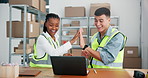 High five, laptop and shipping with people in warehouse for logistics deal, delivery confirmation and profit. Success, ecommerce increase and team with man and woman in factory for partnership