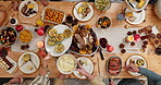 Time lapse, thanksgiving and hands with meal, dining room and together for reunion on festive season. Above, rush and people with food for Christmas celebration, December holiday and eating in house