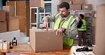 Warehouse, package and man with box cutter for logistics, product inspection and cargo distribution. Order delivery, export process and employee open parcel for check, supply chain or quality control