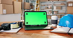 Green screen, empty and laptop on desk for logistics, shipping and dropshipping business. Mockup space, packages and computer for website information for ecommerce, supply chain and distribution