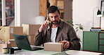Man, laptop and phone call in home office with box for ecommerce, communication or small business. Entrepreneur, talking and side hustle in house with tech for contact, online shop or stock delivery.