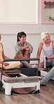 Laugh, talking and women in class for pilates, yoga and exercise for wellness, break and health. Fitness group, happy and people in conversation, talking and bonding in gym studio with machines
