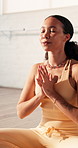 Breathing, meditation and mindfulness with woman in yoga class for balance, holistic health or wellness. Awareness, chakra and stretching with yogi person in studio for healing, inner peace or zen