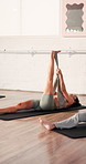 Fitness class, pilates and woman with resistance band in studio, stretching legs or core training. Workout session, flexibility challenge or people in health club to exercise, high angle or wellness