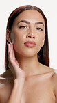 Woman, touch face and beauty in studio with results, texture and smooth skin on white background. Person, model and portrait with cosmetics, natural makeup and glow with transformation in Colombia