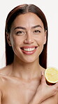 Lemon, skincare and face of woman in studio for vitamin c, treatment and cosmetics for smile. Portrait, fruit and model with diy facial, organic or skin detox with citrus cleaning on white background