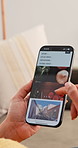 Breaking news, hands and phone screen with person on sofa in living room of home for information. App, scrolling and search with woman reading article or report in apartment for media publication