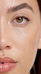 Beauty, makeup and half face of woman in studio for mascara, self care and aesthetic. Microblading, glow and closeup with portrait of person for shine, cosmetology and eyelash growth treatment