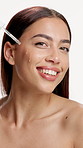 Face, happy woman and skincare in studio with serum for hydration, dermatology and collagen benefits. Confident, person and hyaluronic acid for beauty, healthy skin and wellness on white background.