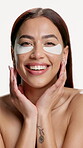 Face, skincare or woman with eye patches in studio, natural beauty or hydration in wellness product. Portrait, person or dermatology with mask for dark circles, self care and glow on white background